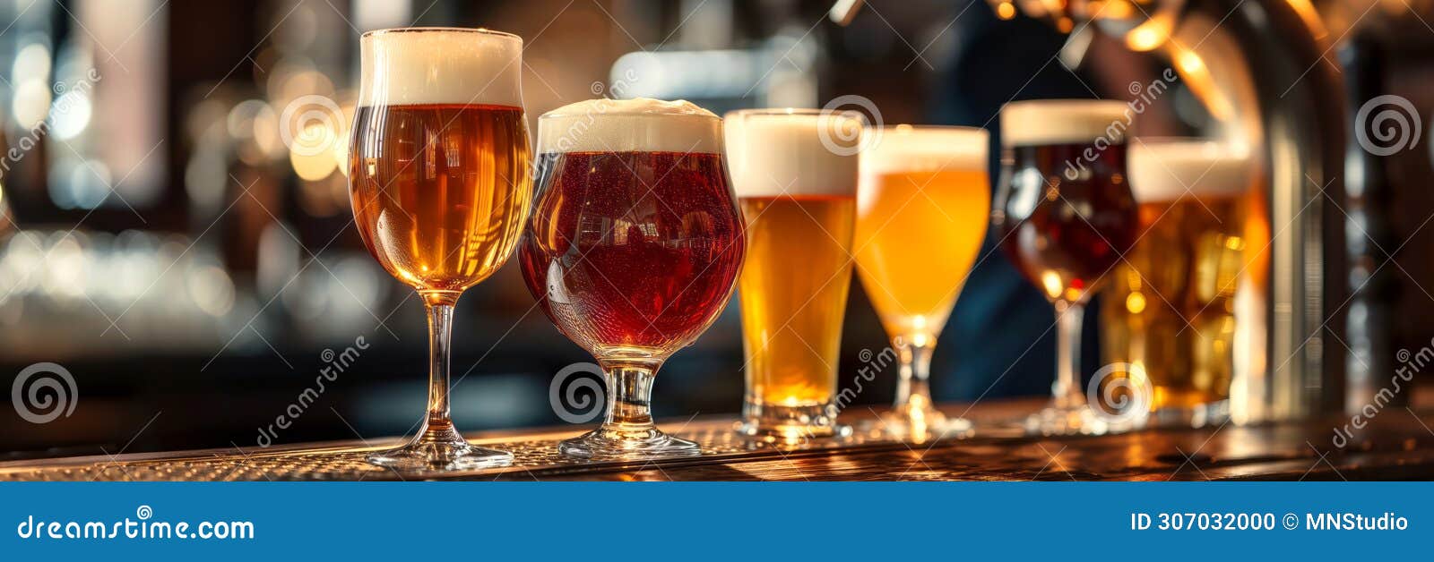 assortment of different craft beers in various glasses on bar counter in traditional irish pub. drinking alcoholic beverage