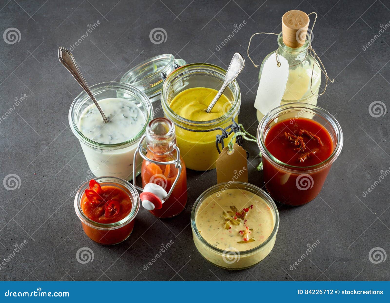 assortment of dressings, sauces and condiments