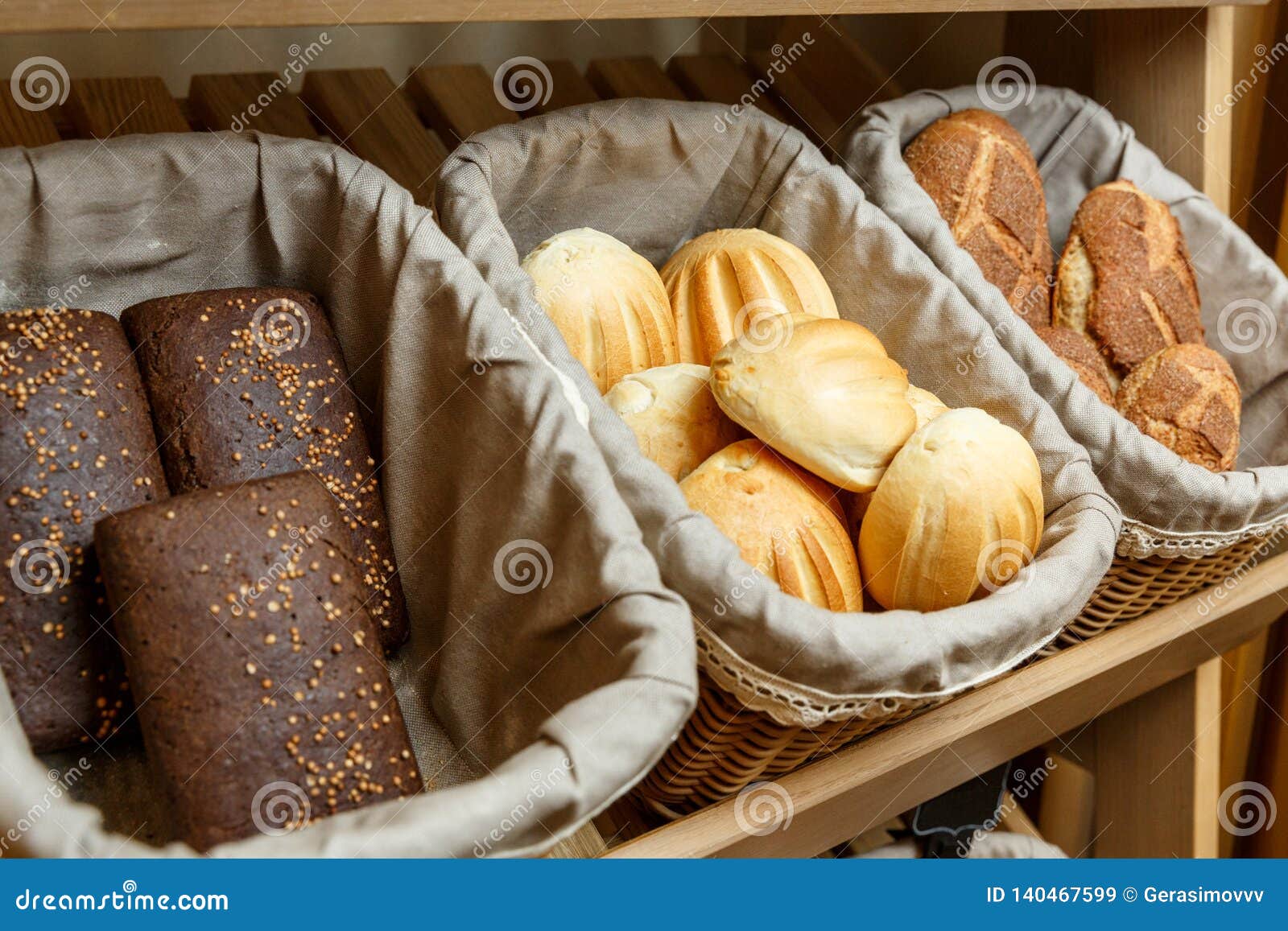 Assortment of Fresh Bread in Baskets in Bakery Stock Image - Image of