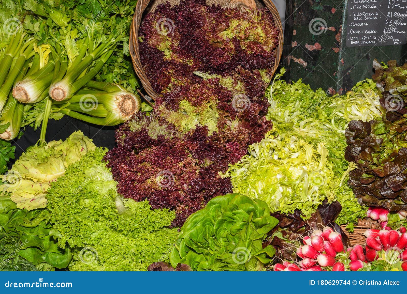 Assortment of Fresh Salads and Vegetables at the Market Stock Photo