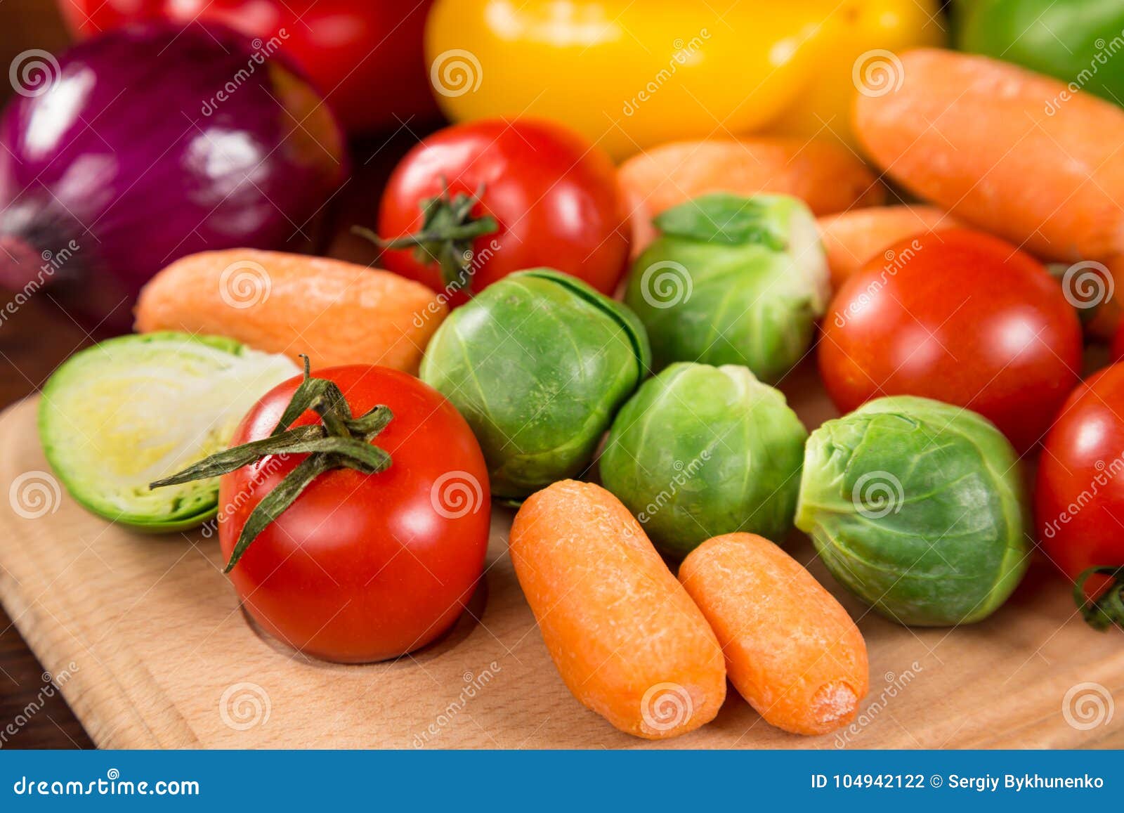 assortment of fresh vegetales on wooden table