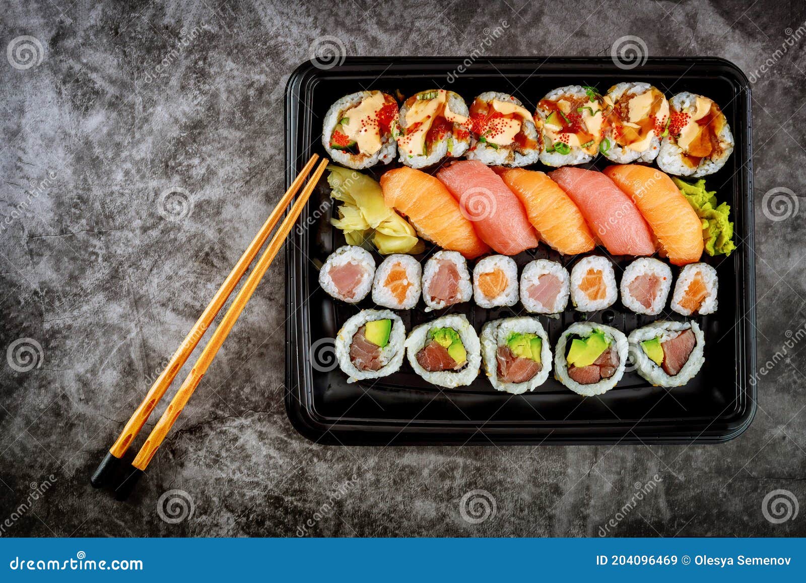 Assortment of Sushi Roll Set on a Black Tray. Japanese Food Stock