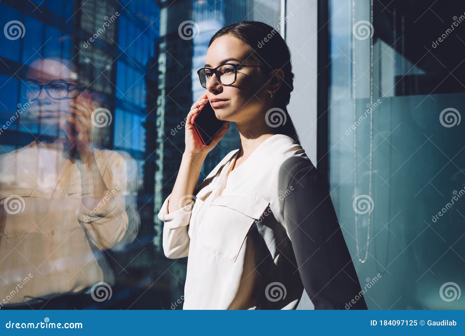 Busy Woman Calling on Cellphone in Office Stock Image - Image of ...
