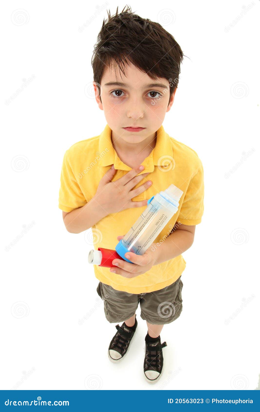 asthmatic child with inhaler and spacer chamber