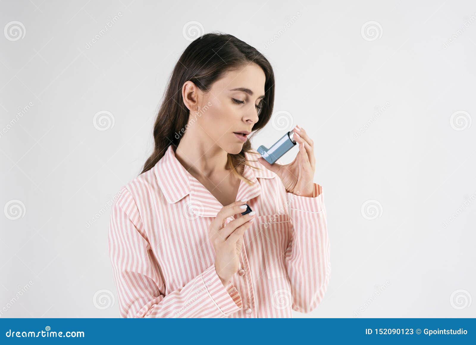 asthmatic woman using an asthma inhaler during asthma attacks