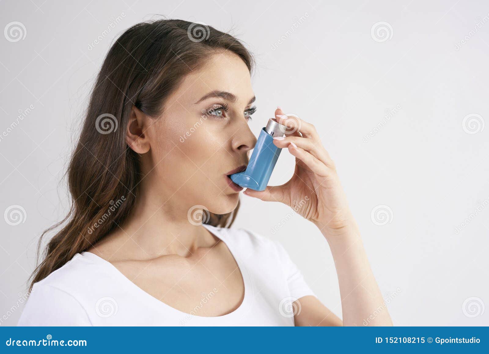 asthmatic woman using an asthma inhaler during asthma attacks