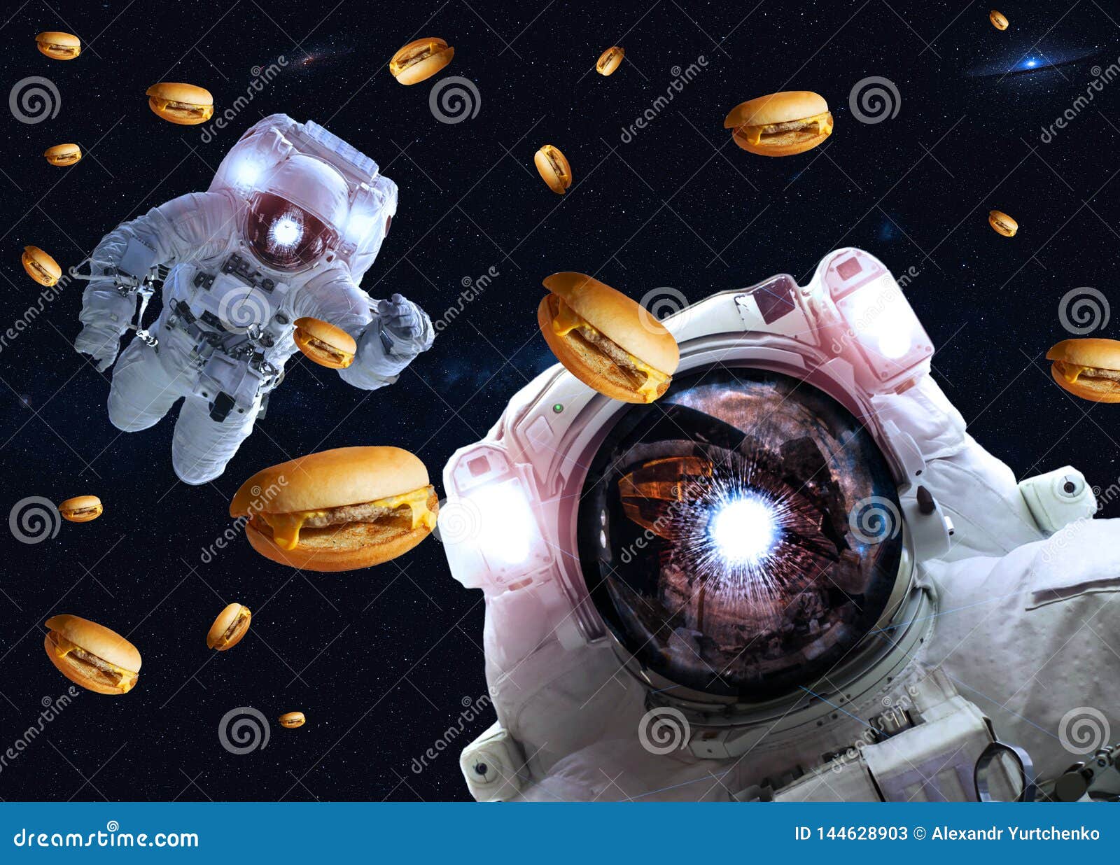 astronauts in outer space with cheseburgers. s of this image furnished by nasa