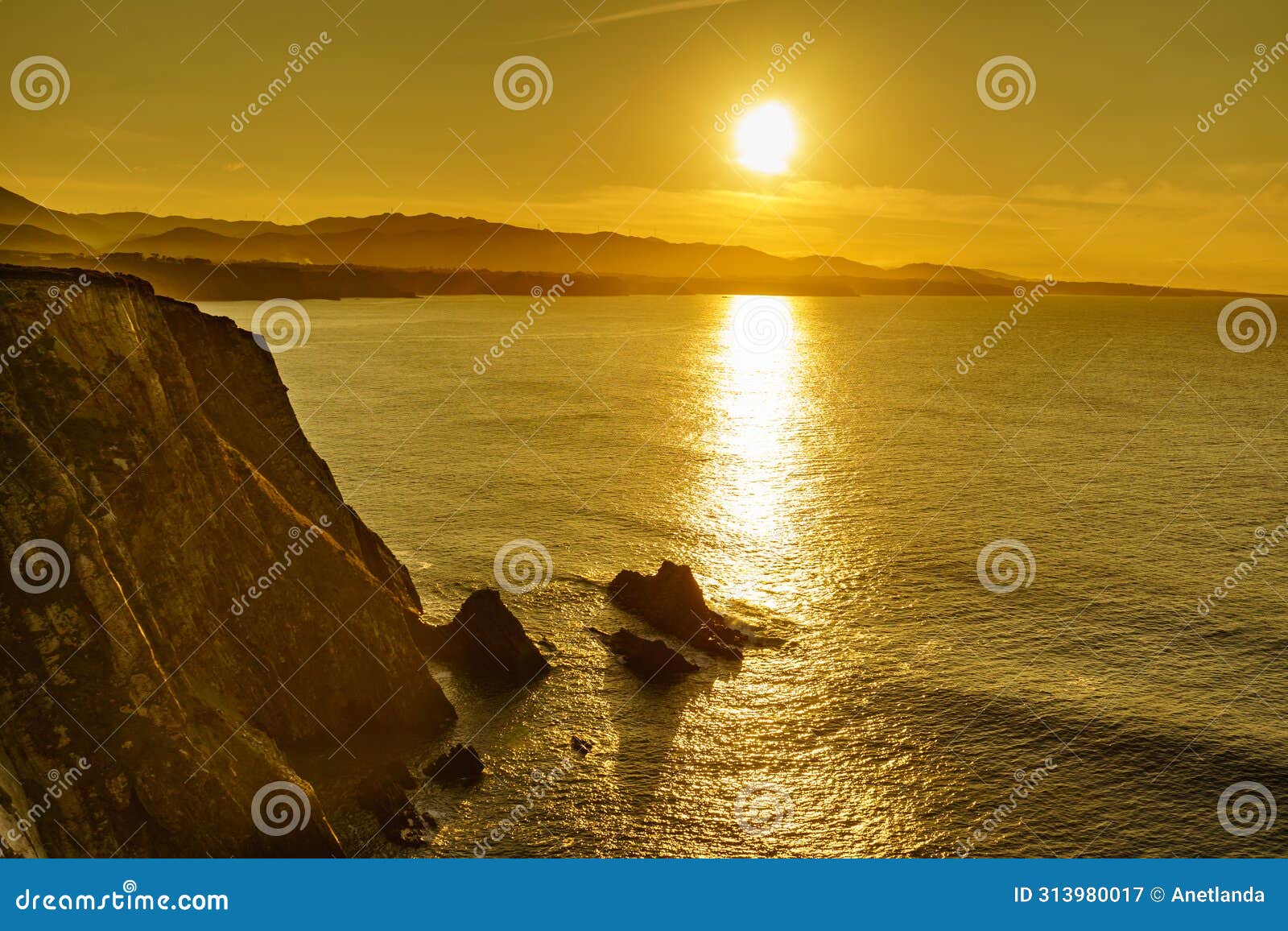 asturias coast. sunset over cabo busto cliffs, spain
