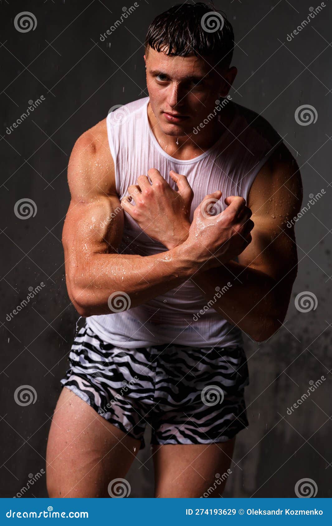 Athlete Bodybuilder Trains in the Studio in the Rain. Stock Image