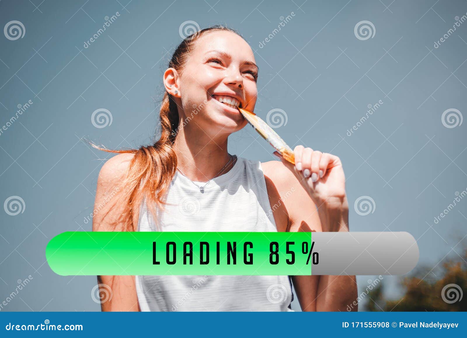 The Athlete is Energized by a Protein Bar. Concept of Recuperation