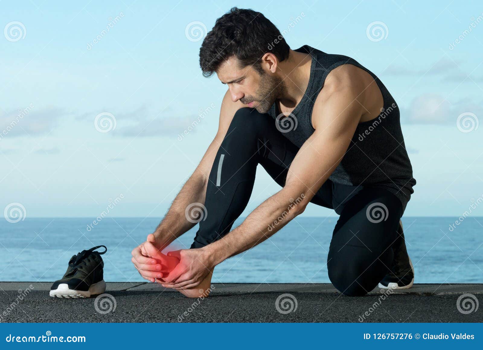 Athlete with foot injury stock photo. Image of clouds 126757276
