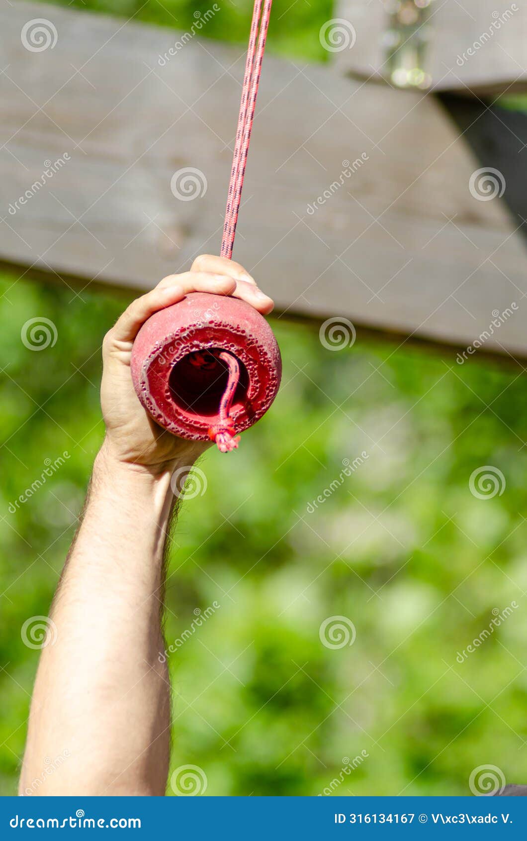 an athlete hand at a hanging obstacle at an obstacle course race, ocr