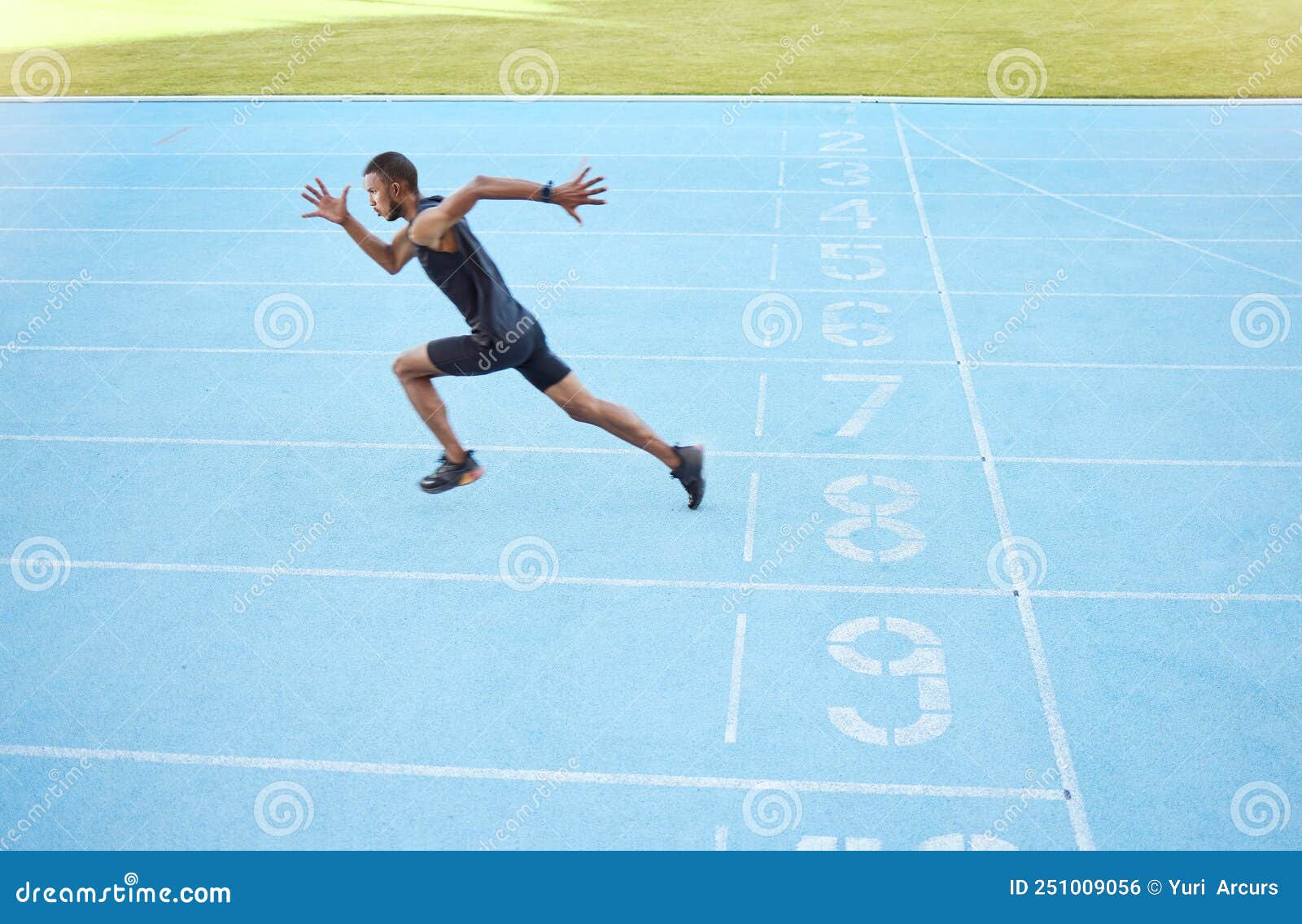 Athlete Running on Track during Competitive Training Practice. Full ...