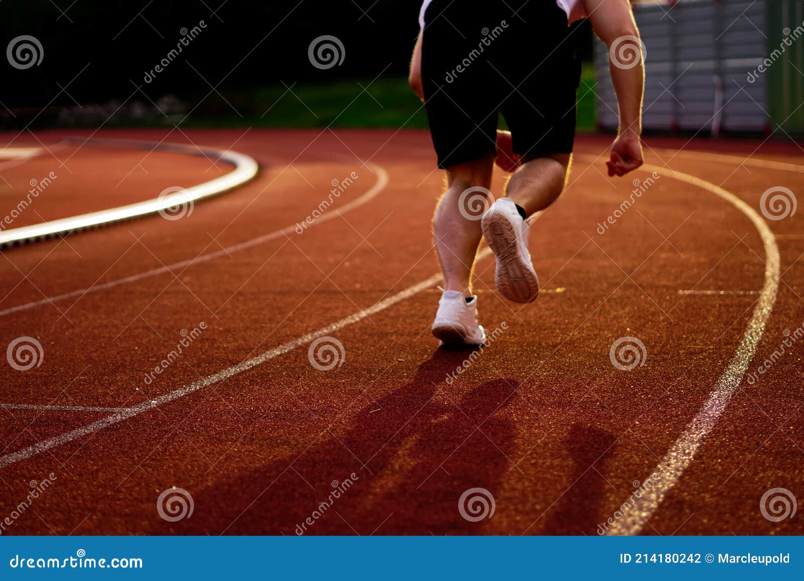 athlete is sprinting over the running track