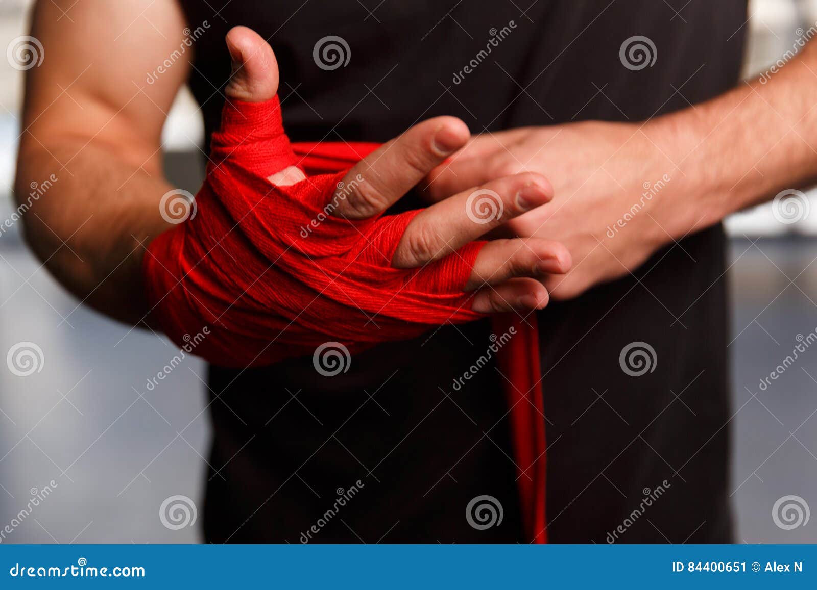 Athlete Wears Black Wristbands. Action. Closeup Of Athlete Adjusts His