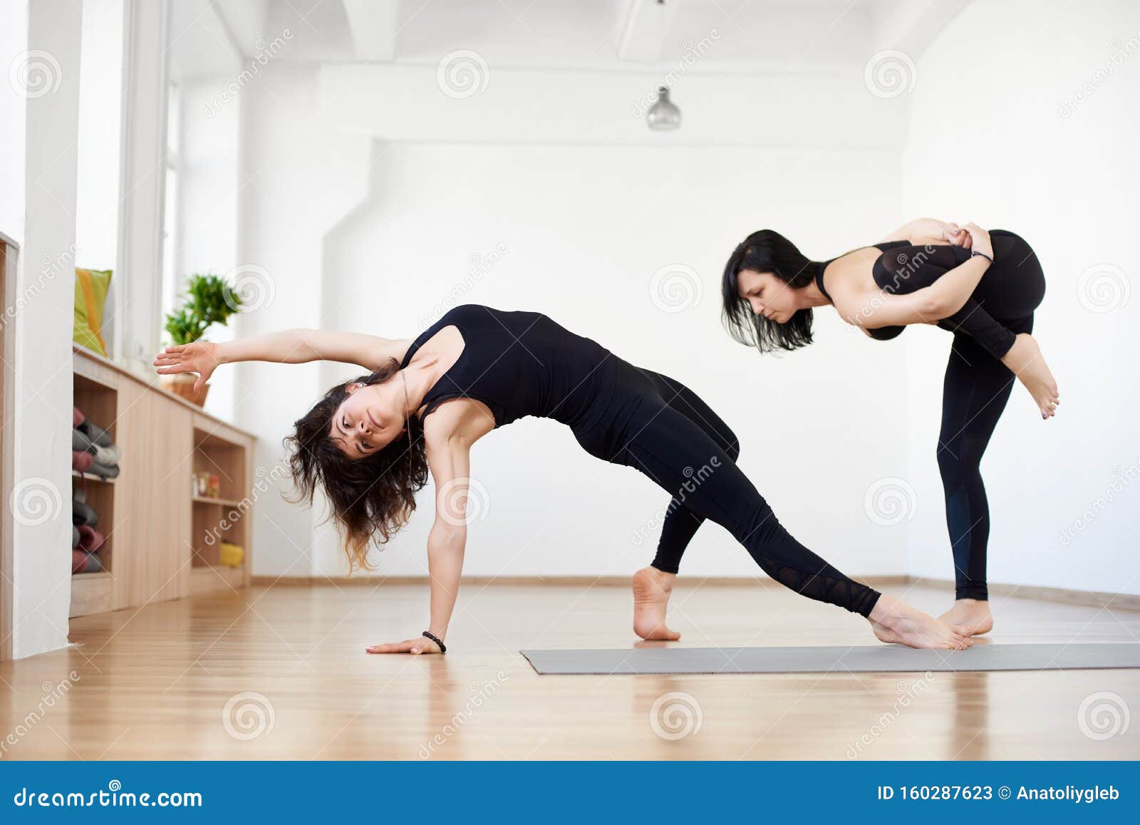 Athletes Partner Practicing Different Yoga Asanas Stretching Balancing Exercises Wild Thing Pose Action In Sport Club Stock Image Image Of Challenge Healthy