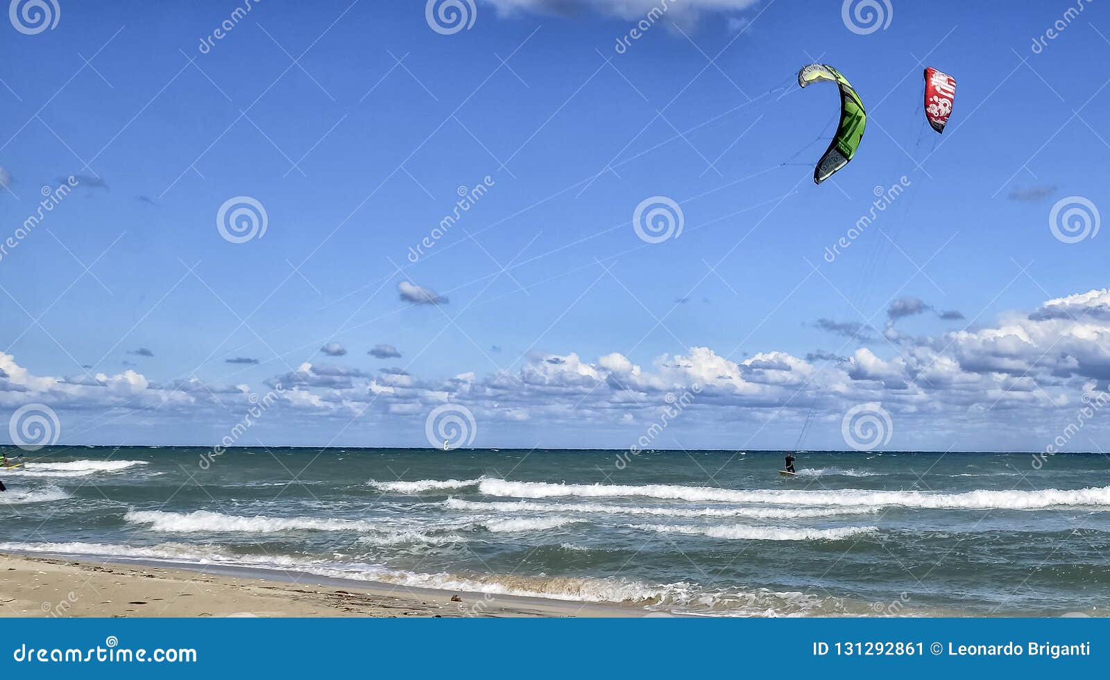 Athletes Practicing Beach Volleyball During Summer Sunset Editorial