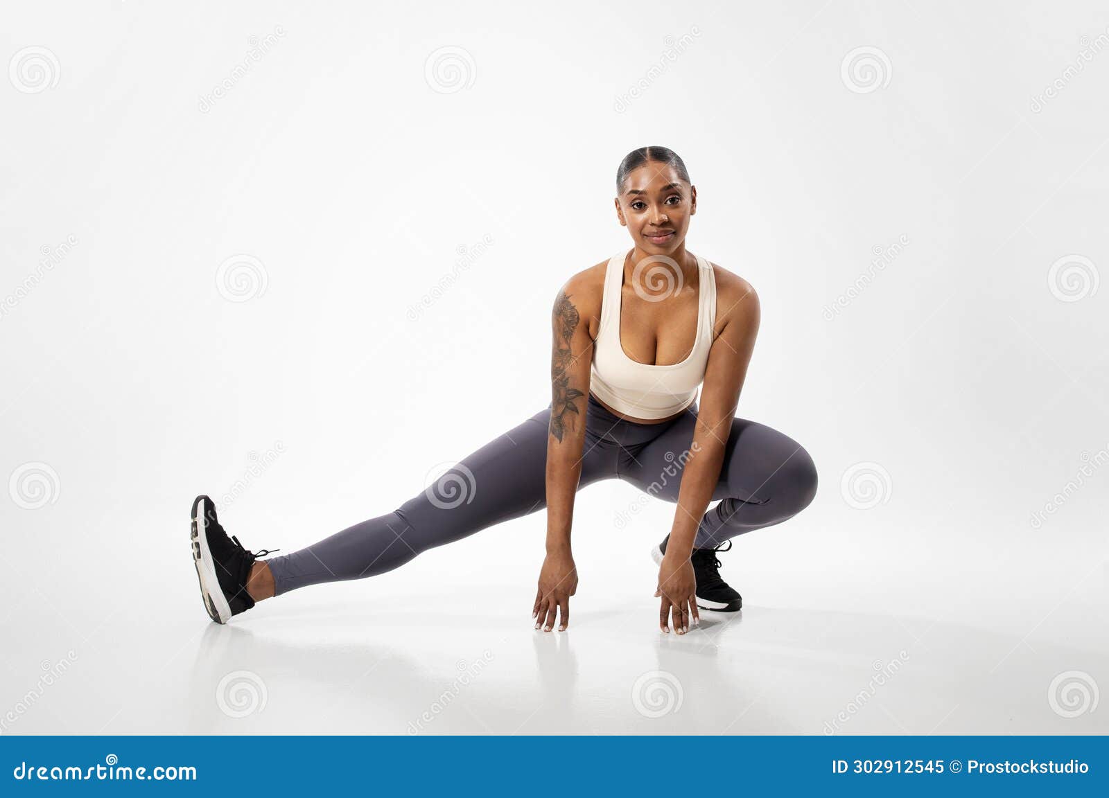 Athletic African American Woman Exercising Stretching Legs Muscles