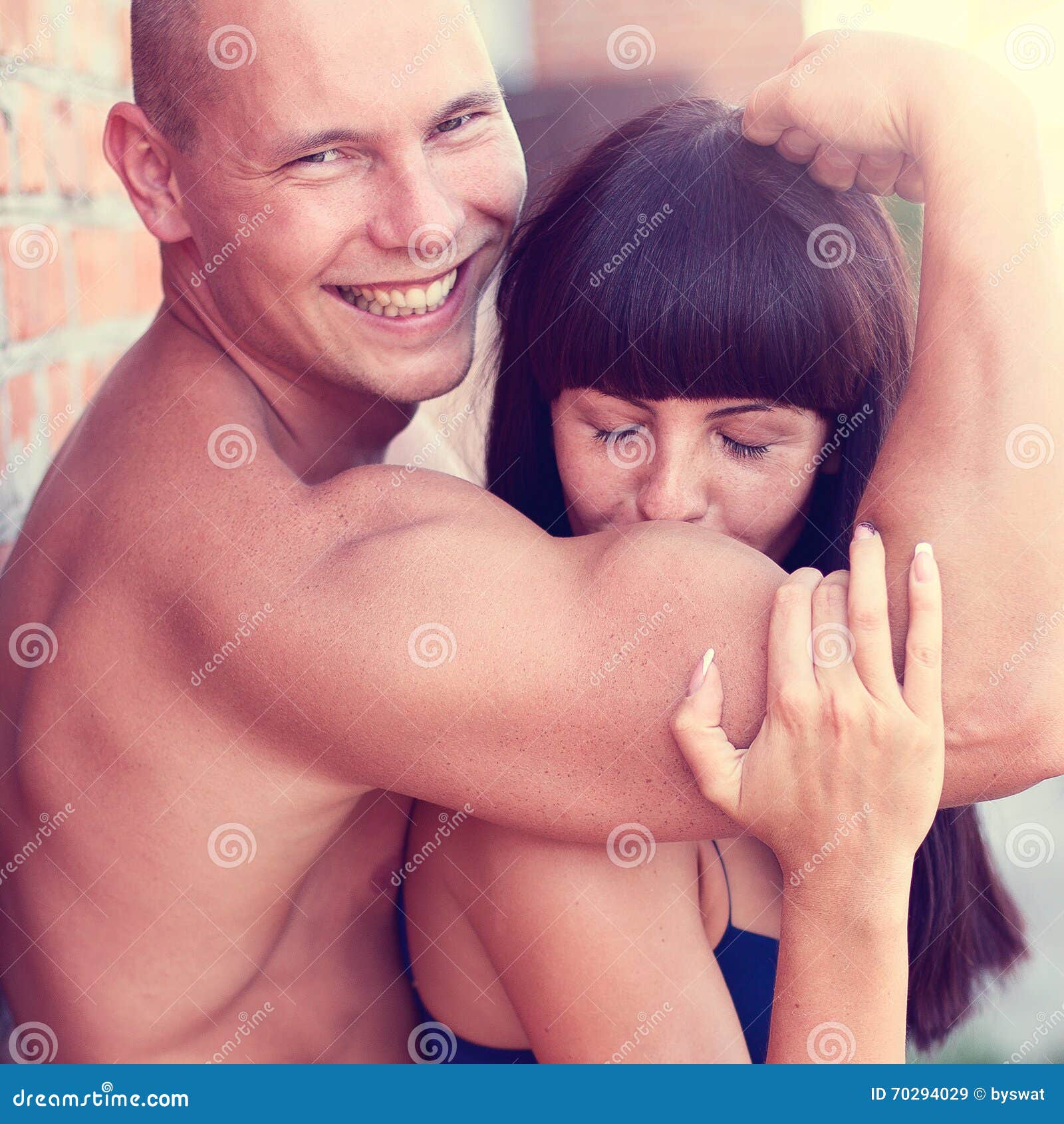 Athletic Beauty Man and Girl Kissing Hand Stock Image image