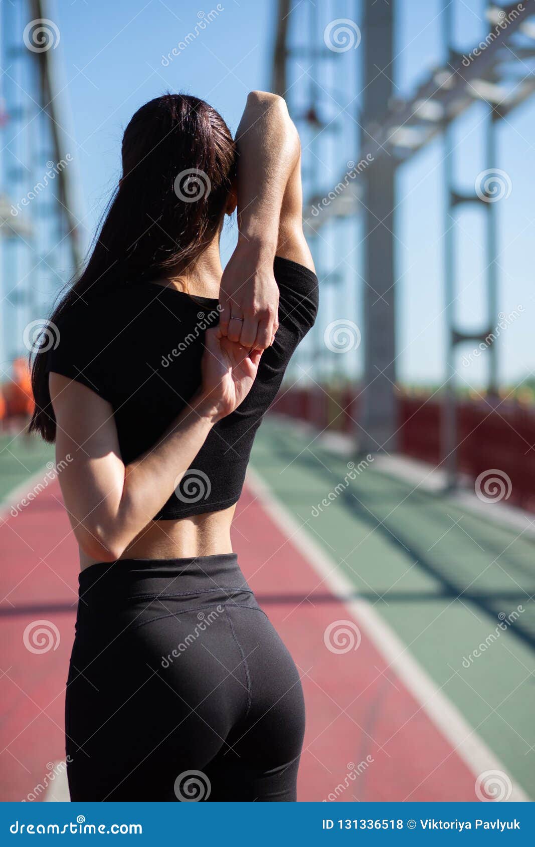 Athletic Brunette Woman Stretching before Workout at the Running Stock ...