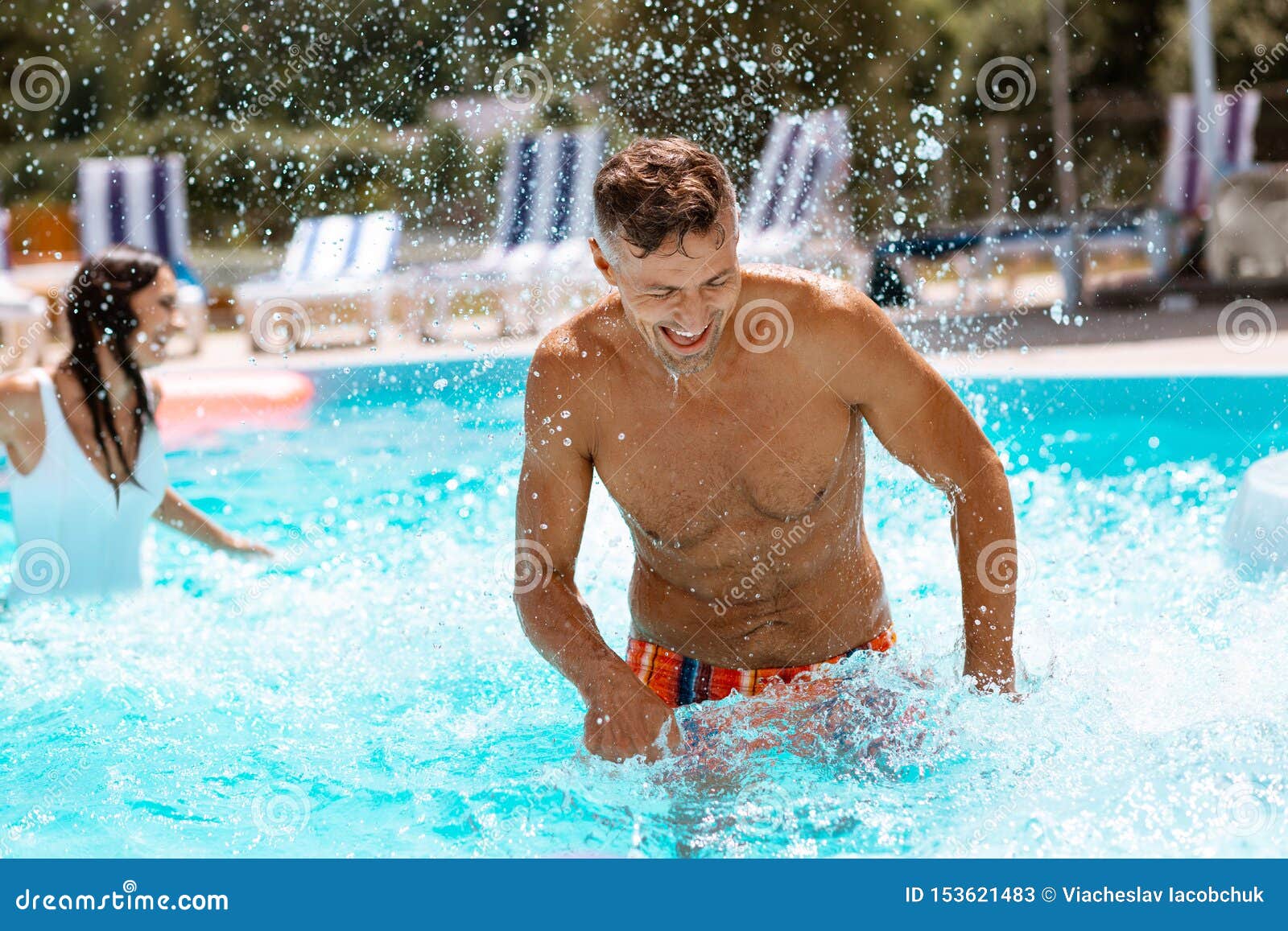 Athletic Handsome Man Laughing After Swimming With Wife Stock Image