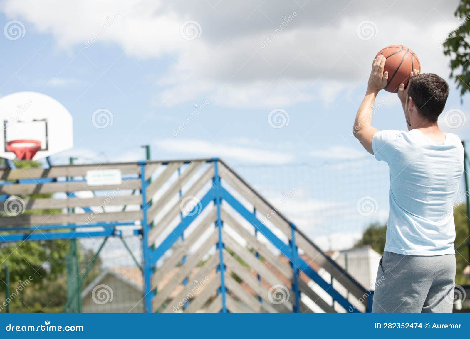 Athletic Male Basketball Player in Action Outdoors Stock Photo Image