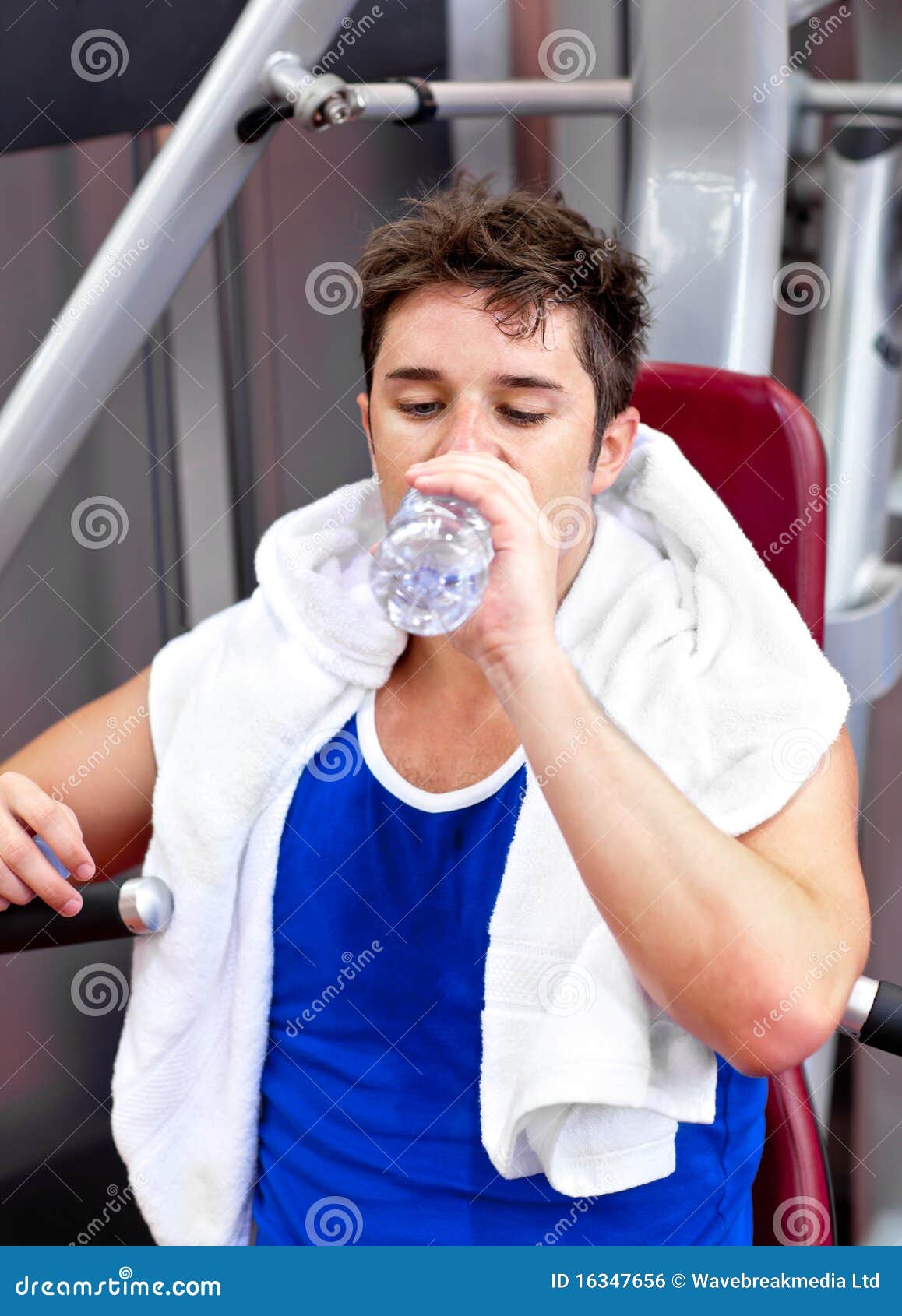 Happy young man drinking water after workout outdoors stock photo (124775)  - YouWorkForThem