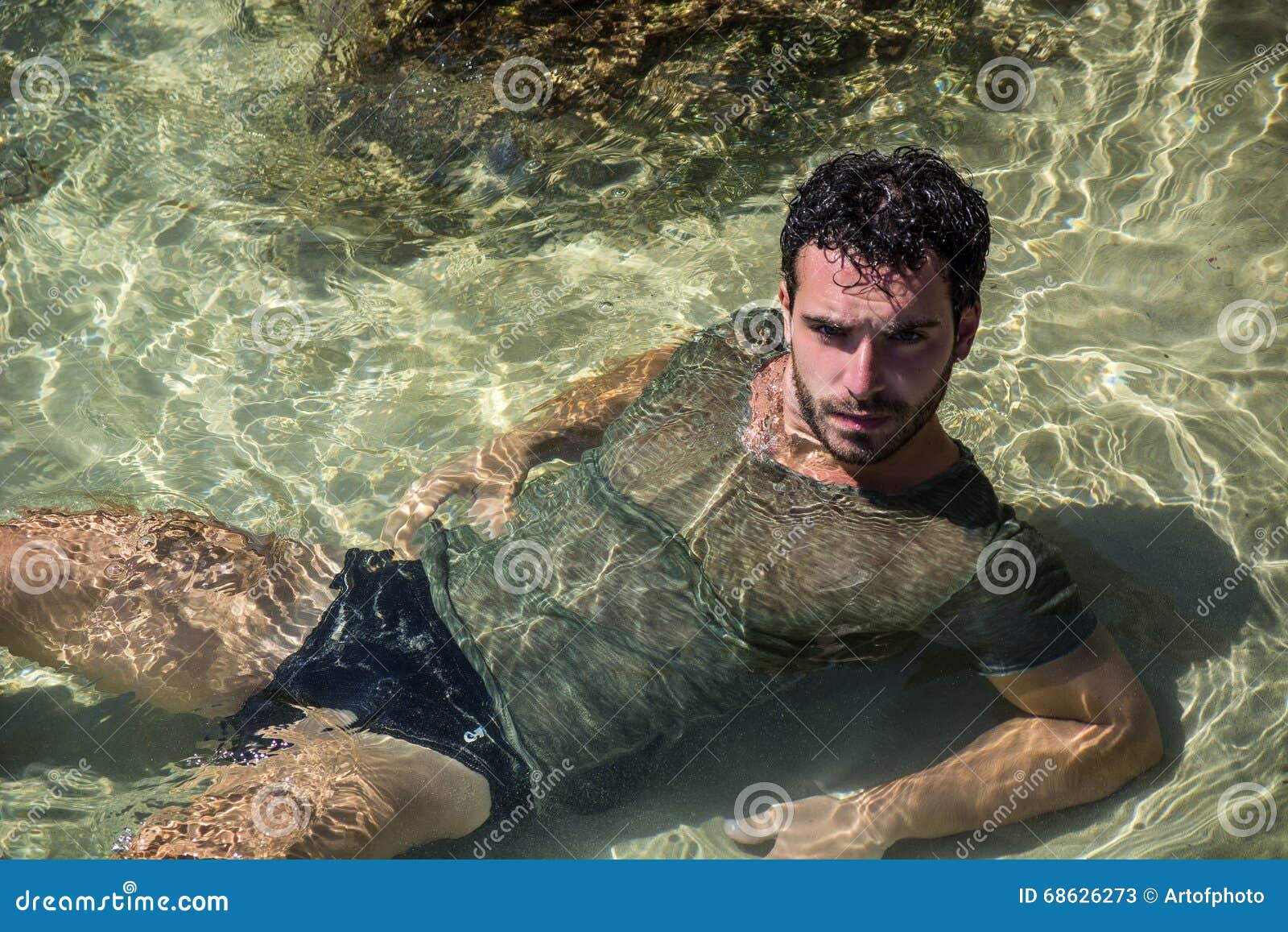 [Image: athletic-man-sea-ocean-rocks-wet-t-shirt...626273.jpg]