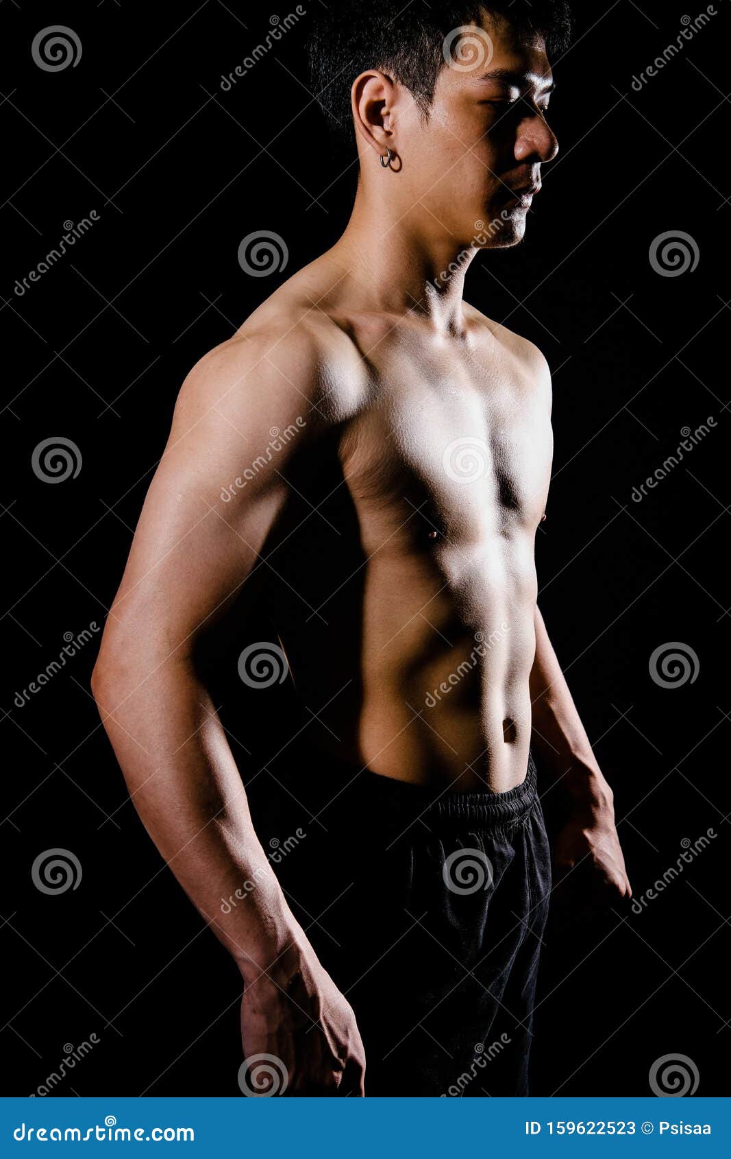 Beautiful long-haired man with a naked muscular torso 