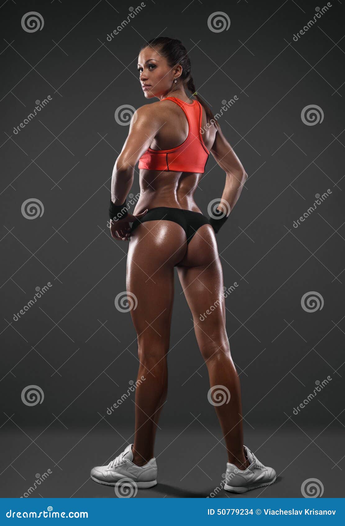 Athletic Woman Showing Muscles of the Back Stock Photo - Image of