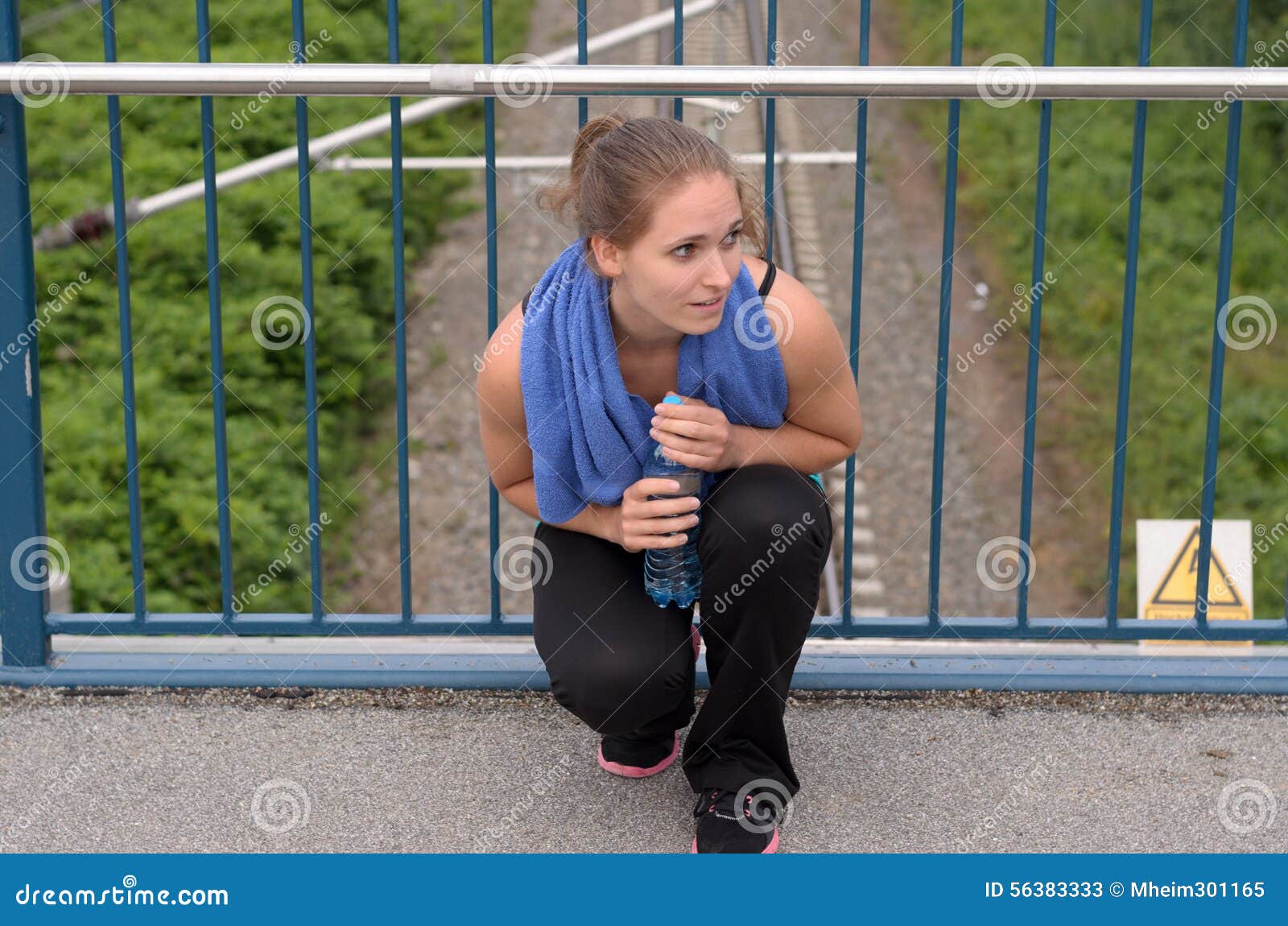 Athletic Woman Squatting at the Bridge with Water Stock Image - Image ...