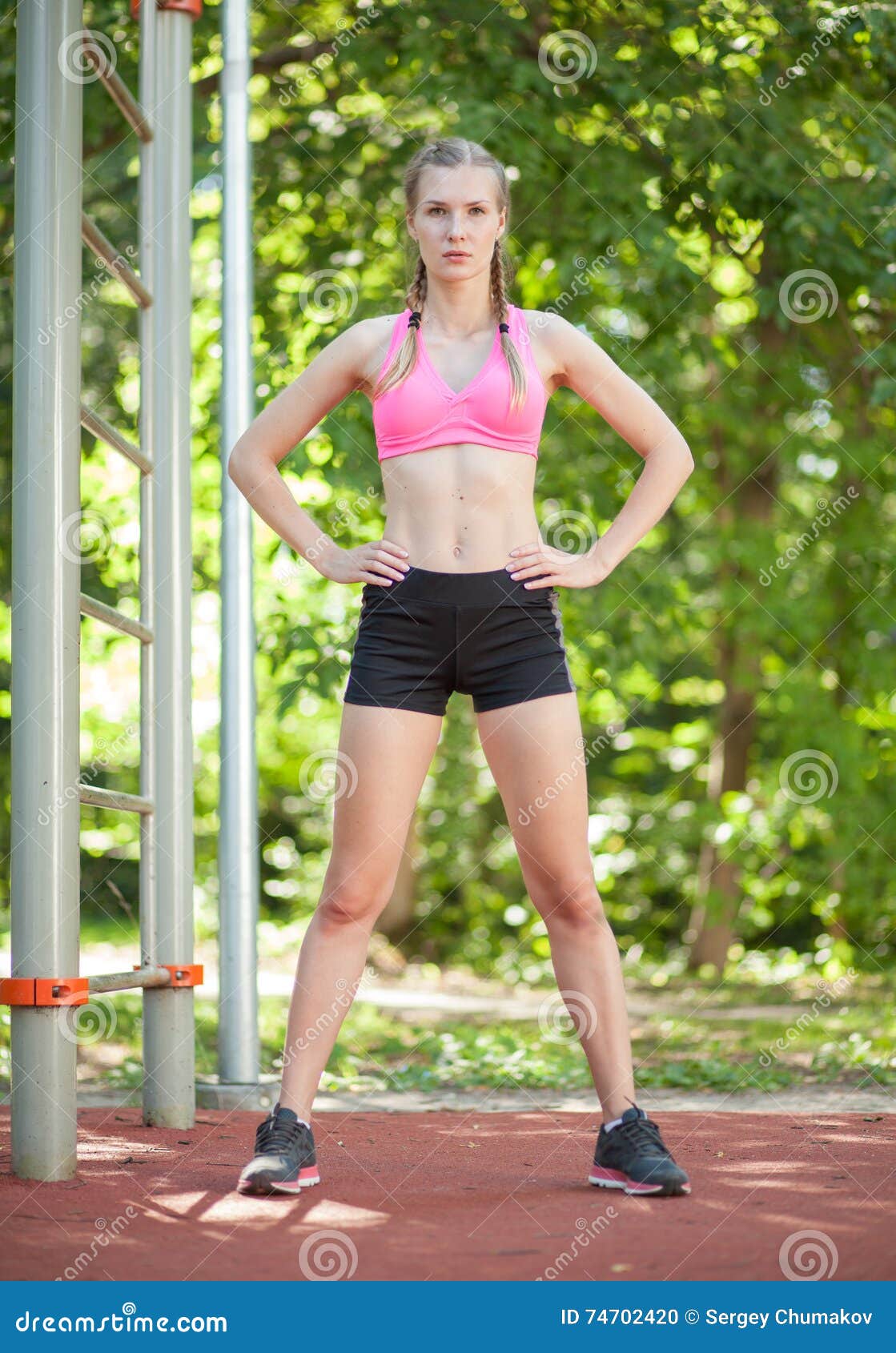 Athletic Woman Standing in Fitness Attire Stock Photo - Image of outdoor,  muscular: 74702420