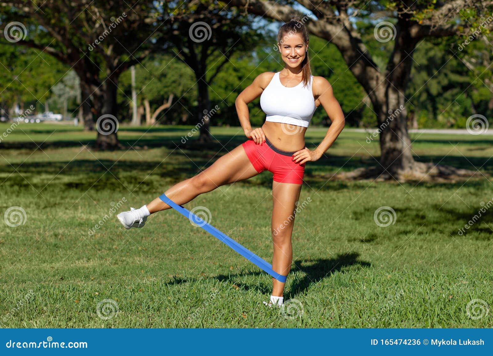 Athletic Woman Workout with Resistance Band Outdoors. Fitness Girl Doing  Exercise for Legs at the Park Stock Photo - Image of muscle, glutes:  165474236