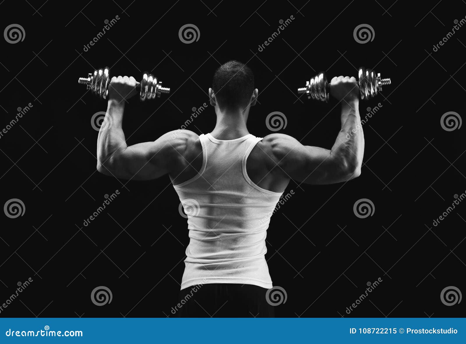 Muscular Man Exercising With Dumbbells Stock Image - Image 