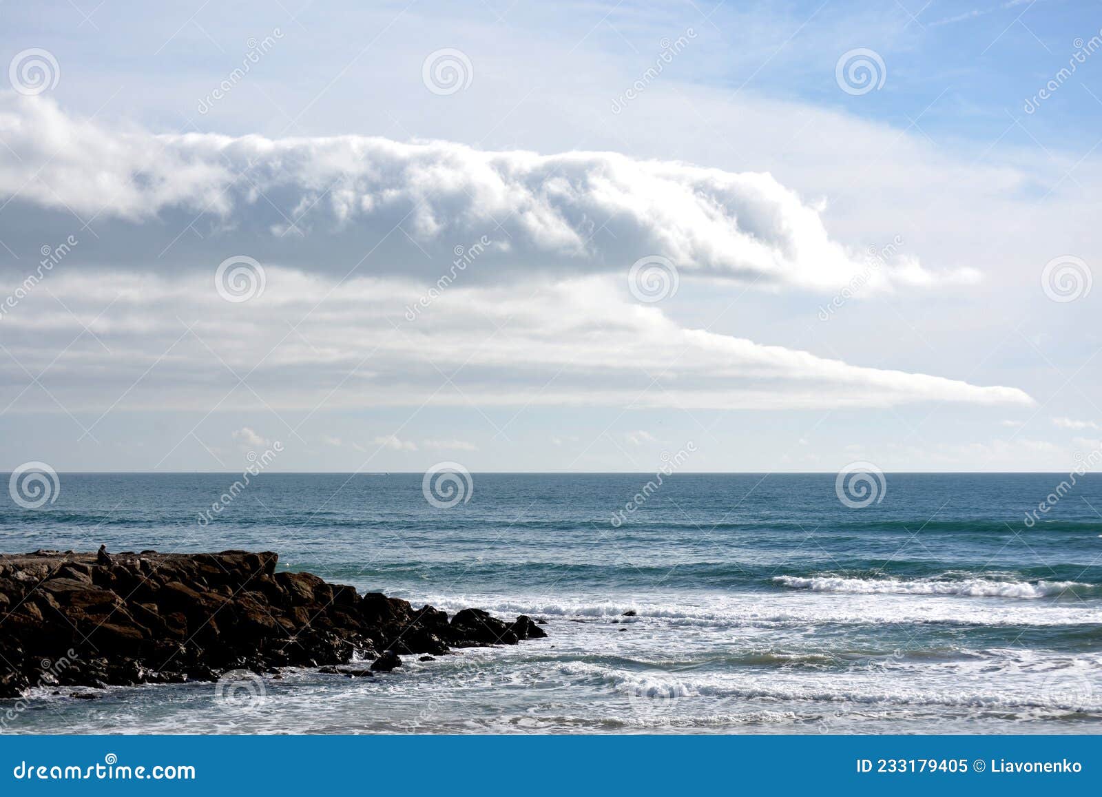 atlantic ocean beach. cloudy and wonderful sky. portugal almada. europe.