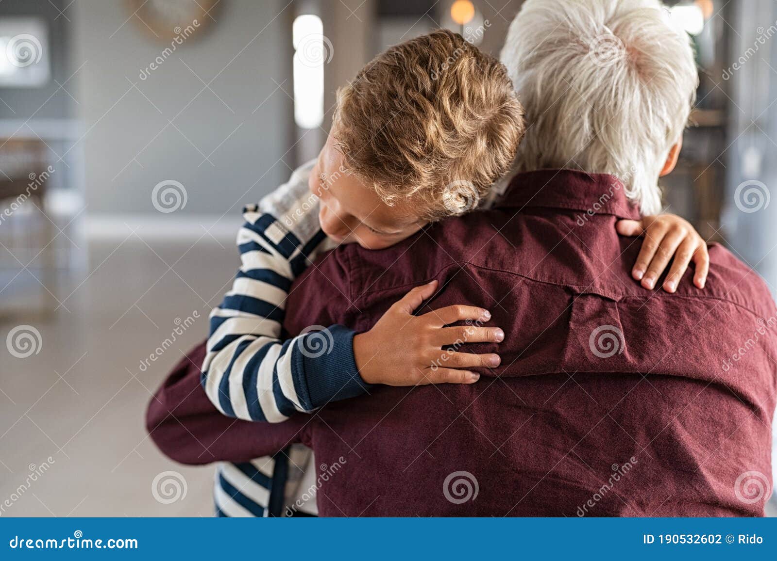 attached child hugging his grandfather