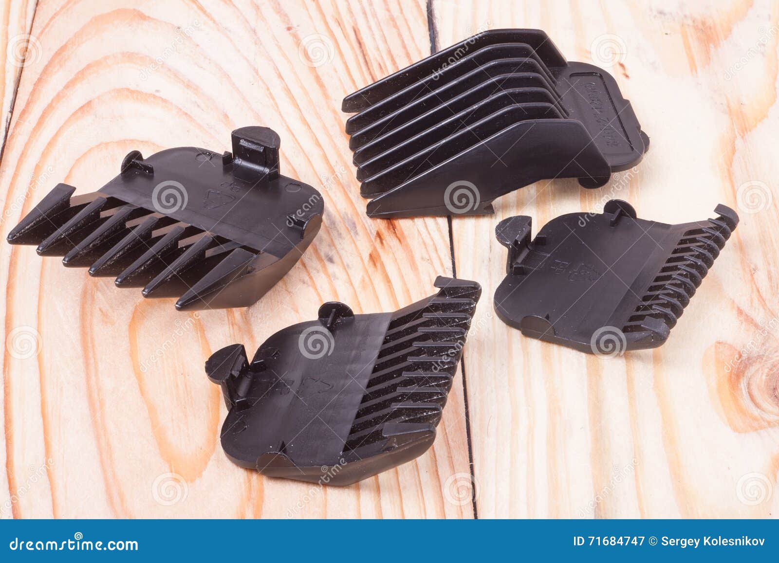 Attachments for Hair Clippers on a Light Wooden Table Stock Image