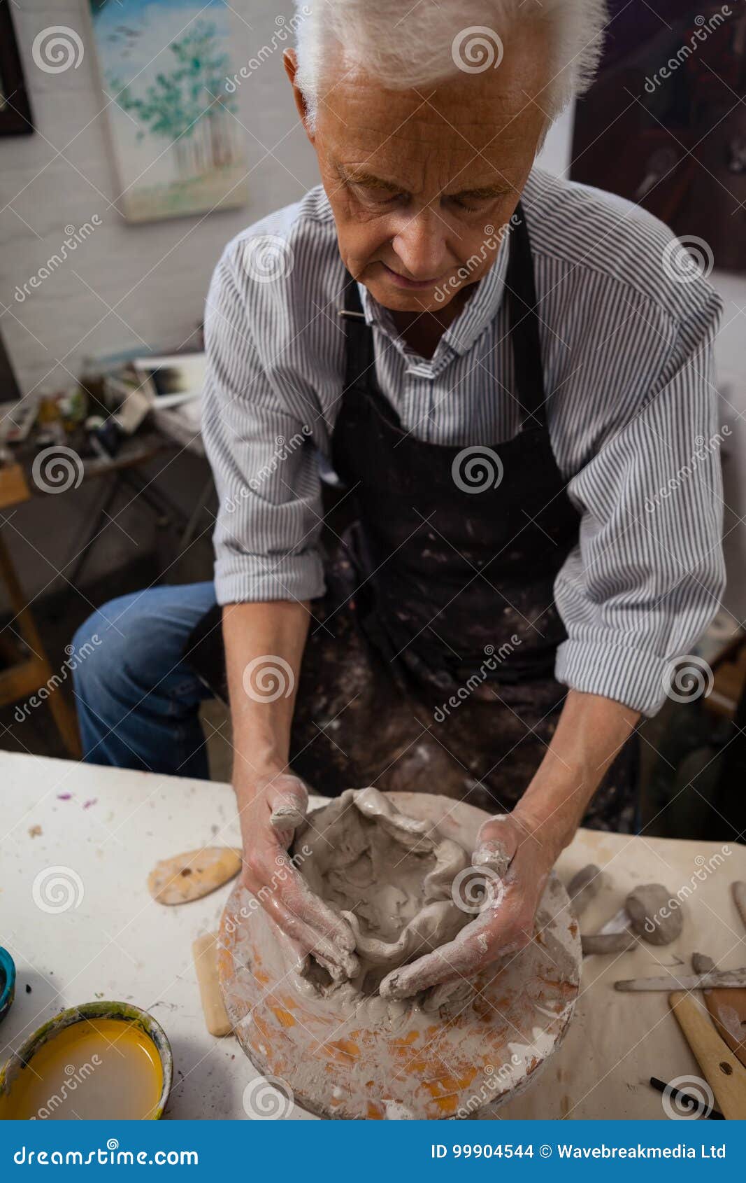 Attentive Senior Man Molding Clay Stock Photo - Image of paint, occupation:  99904544