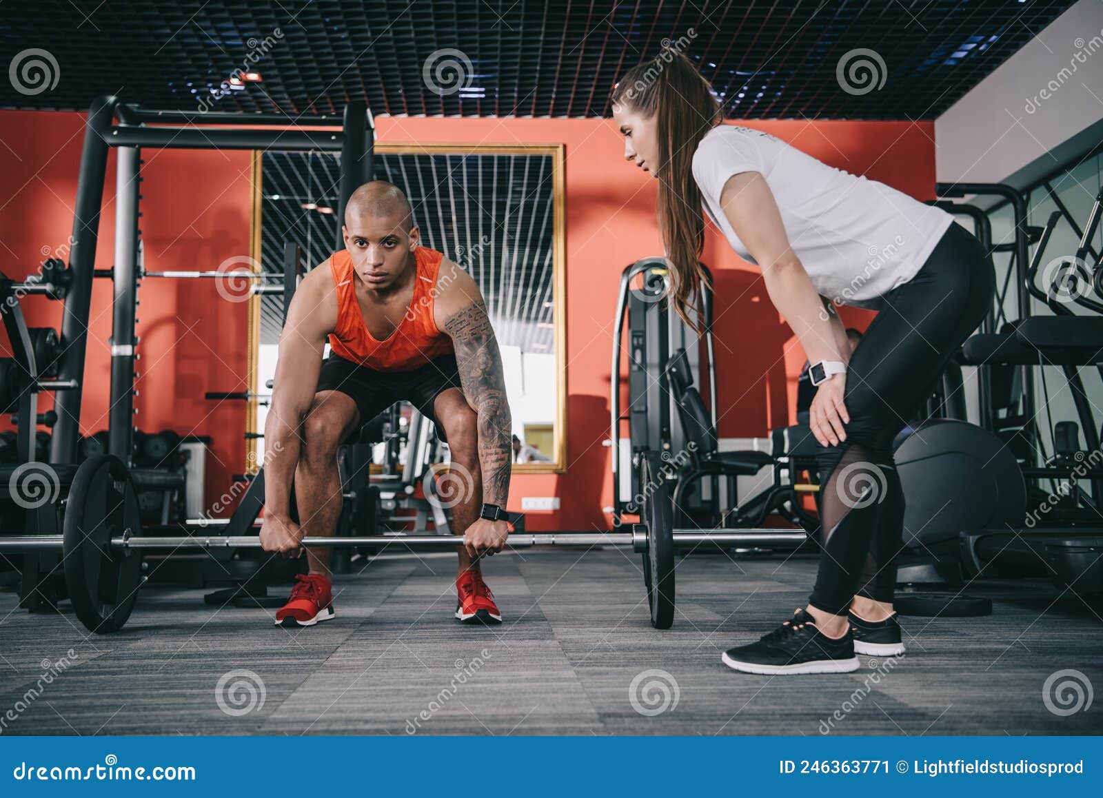 Attentive Trainer Supervising African American Sportsman Stock Image