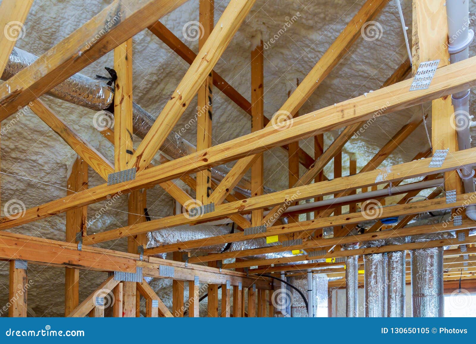 Attic With Foam Insulation Of Heating System On The Roof Of