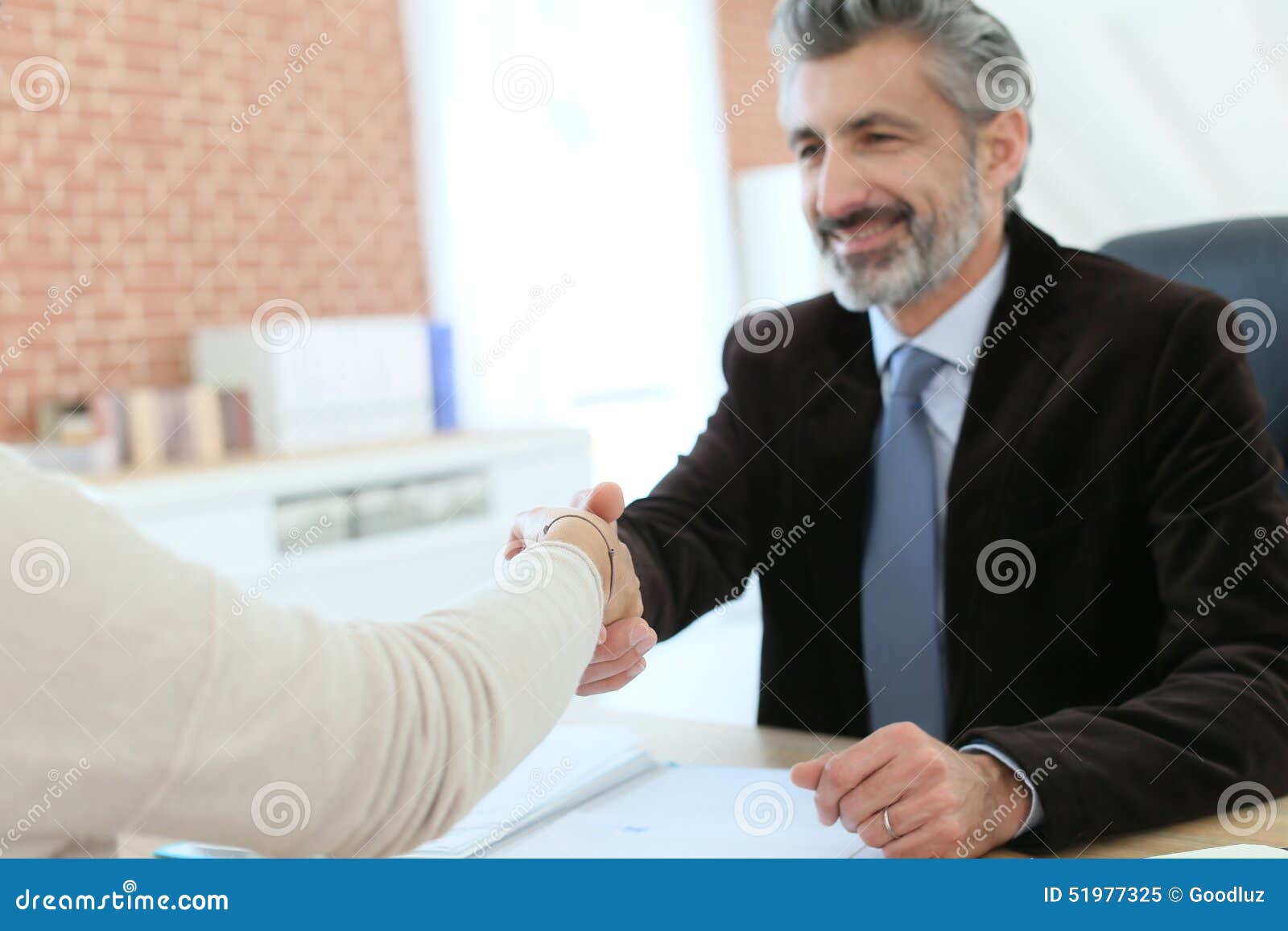 attorney and client handshaking