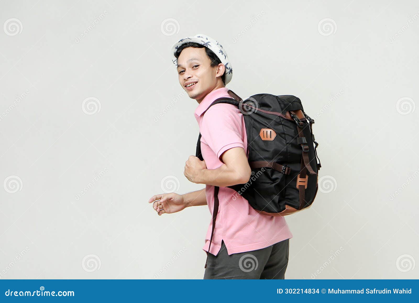 attractive asian man backpacker backpose with greeting hand palm.