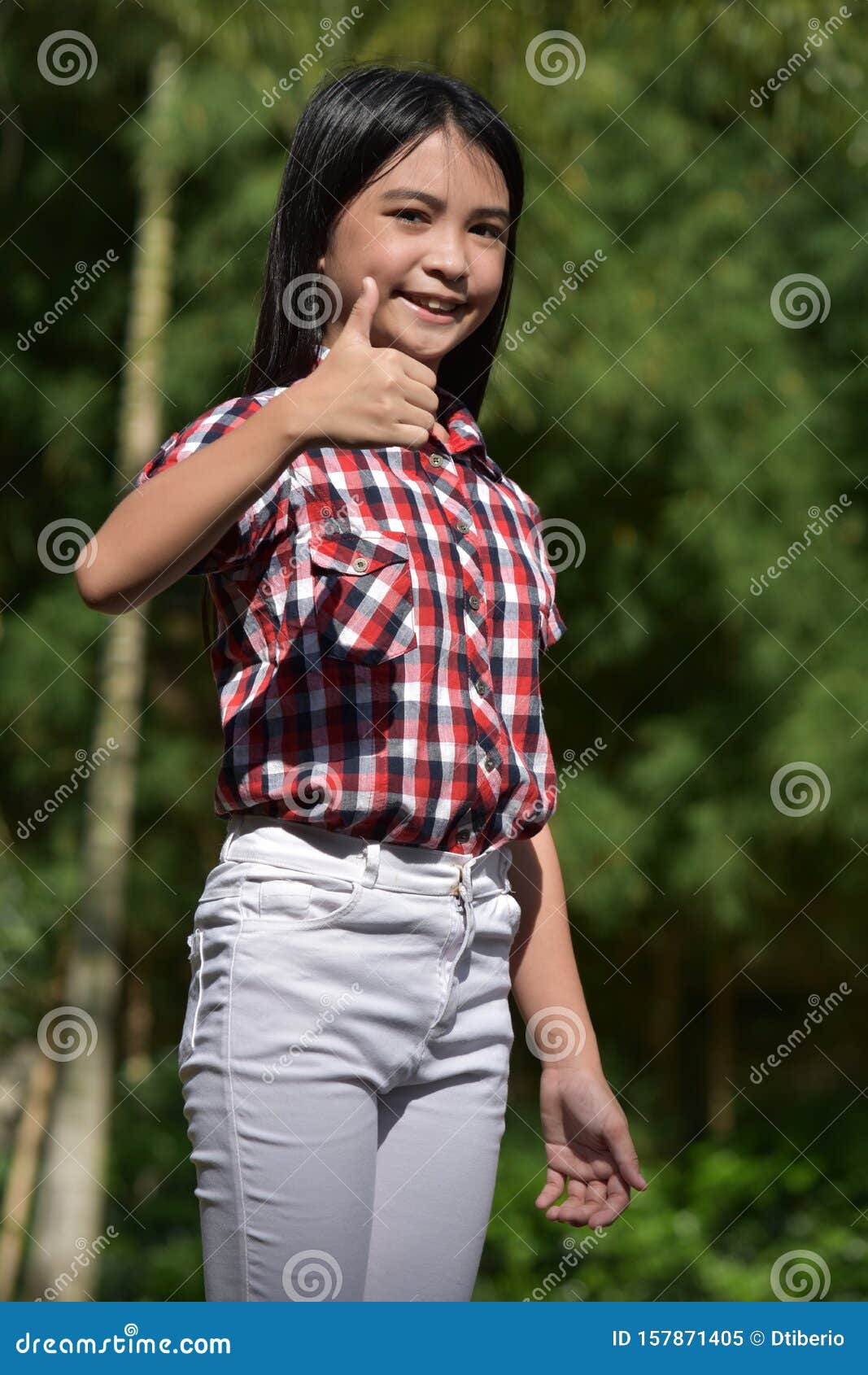 A Filipina Juvenile With Thumbs Up Stock Image I