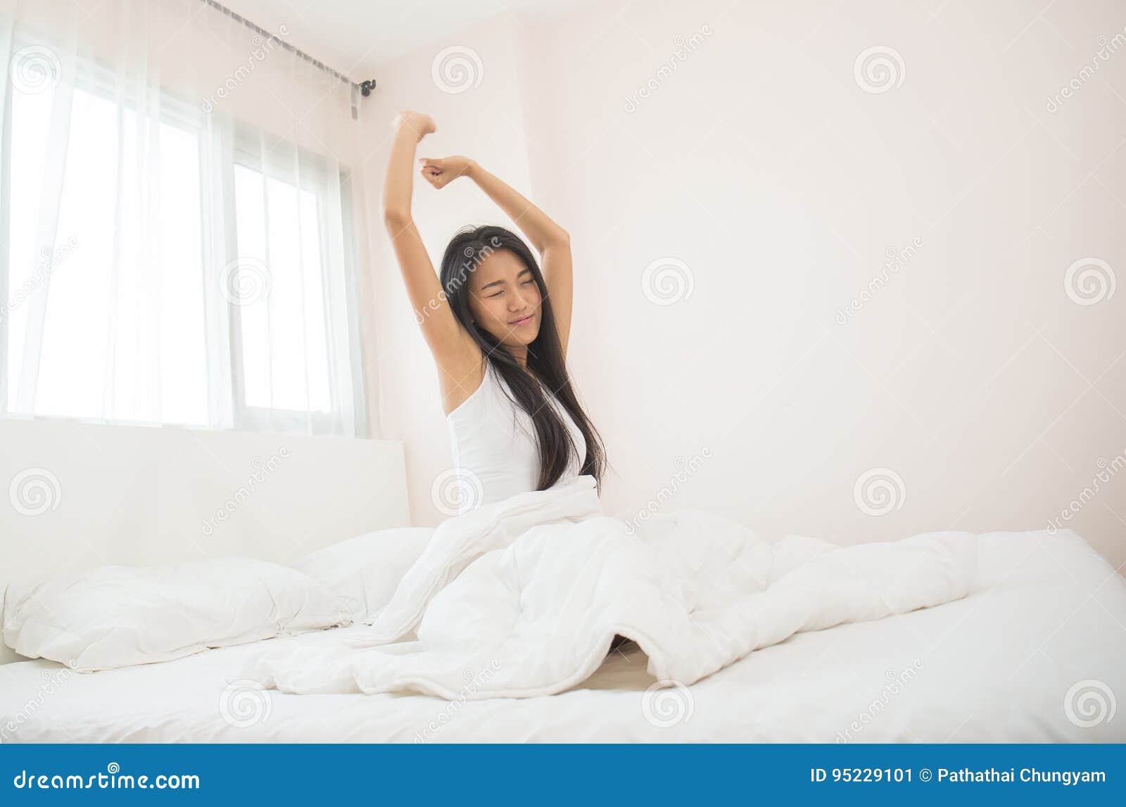 attractive asian woman awaking on the bed & x28;sleep& x29;