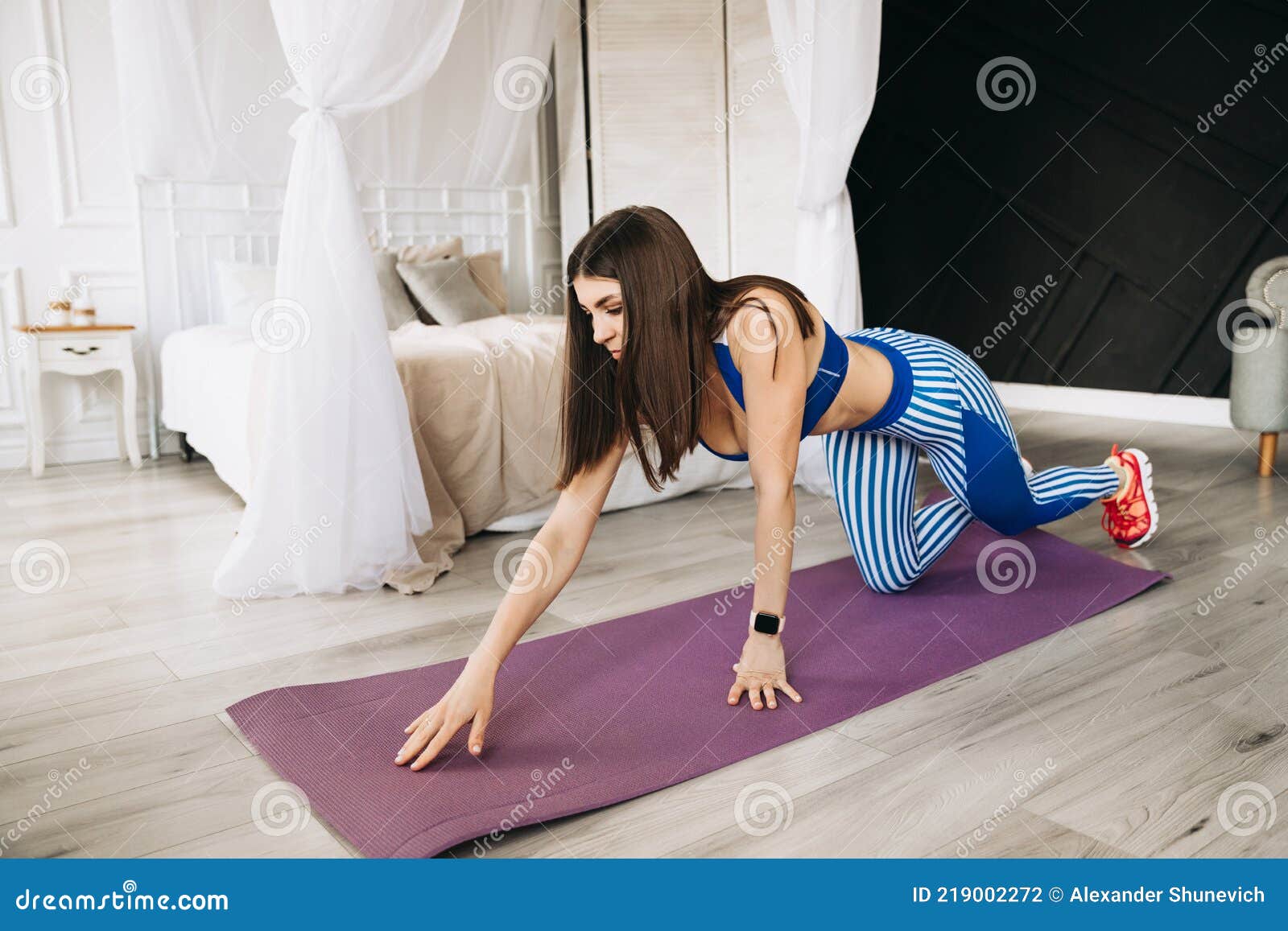 Attractive Beautiful Young Sportswoman, Straightens Yoga Mat and Starts  Exercising at Home Stock Photo - Image of cheerful, fitness: 219002272