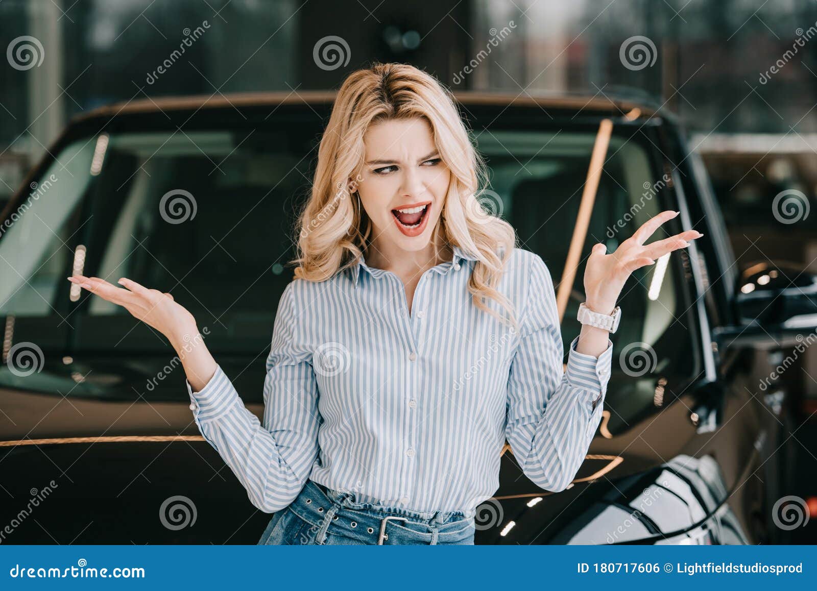 Attractive Blonde Woman Screaming and Gesturing Near Black Car. Stock ...