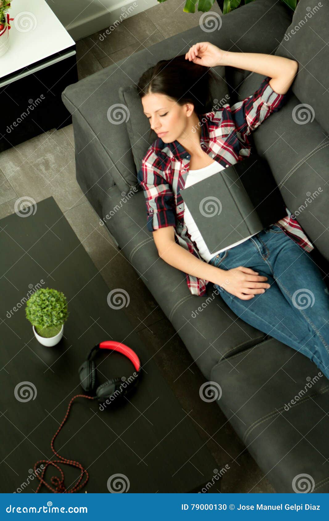 Attractive Brunette Girl Sleeping On The Sofa View From Above Stock