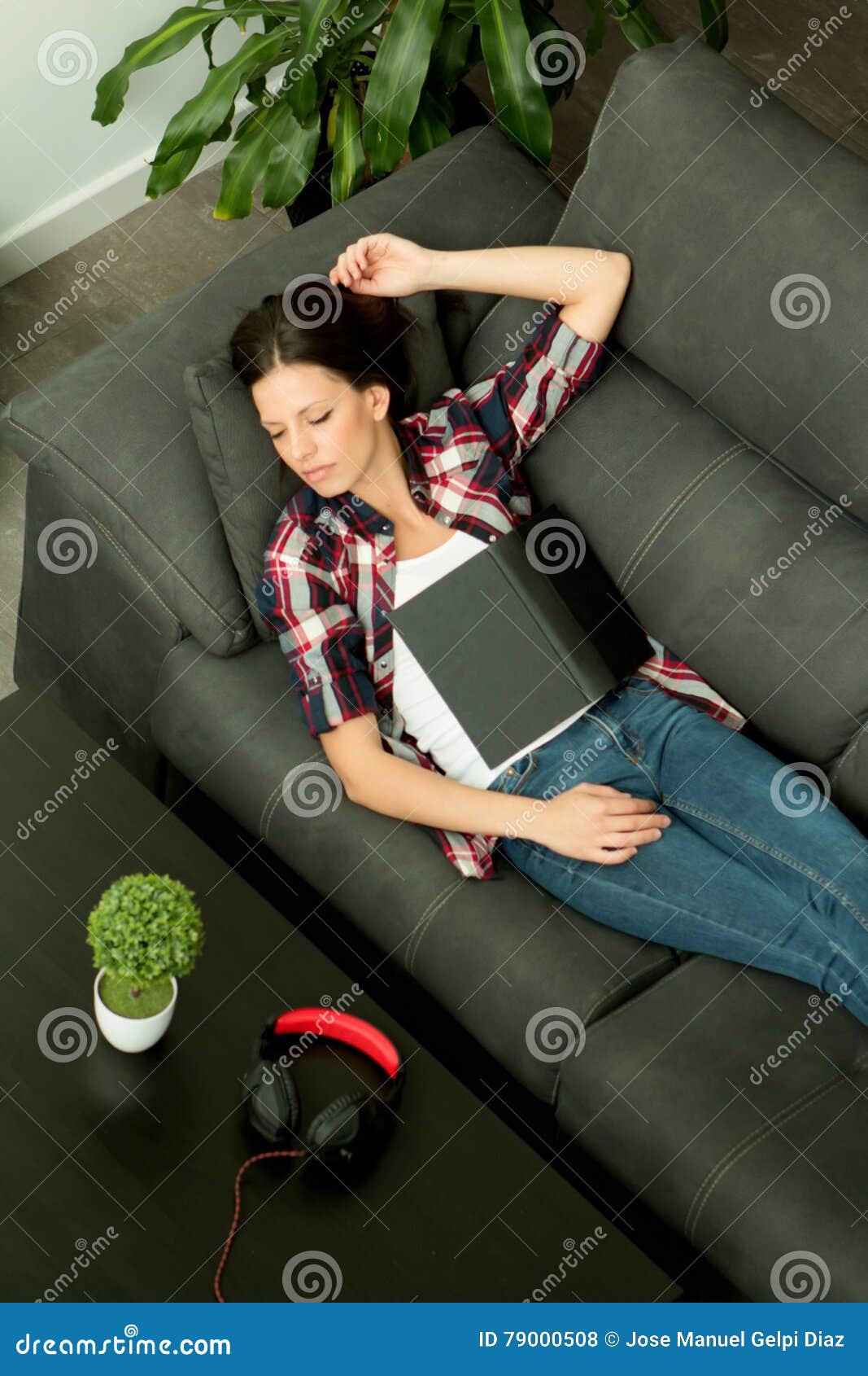 Attractive Brunette Girl Sleeping On The Sofa View From Above Stock