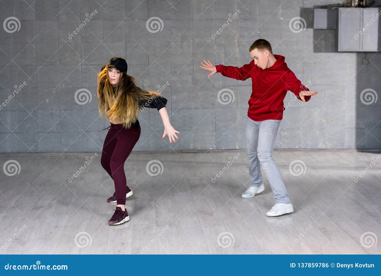 Attractive Casual Couple Dancing Hip-hop. Stock Photo - Image of