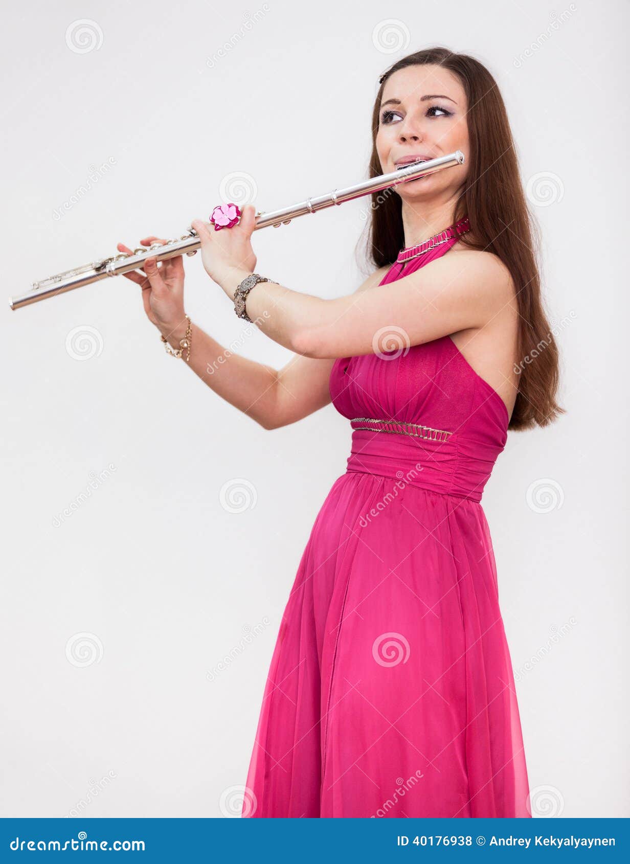 attractive caucasian woman a flutist playing on silver flute